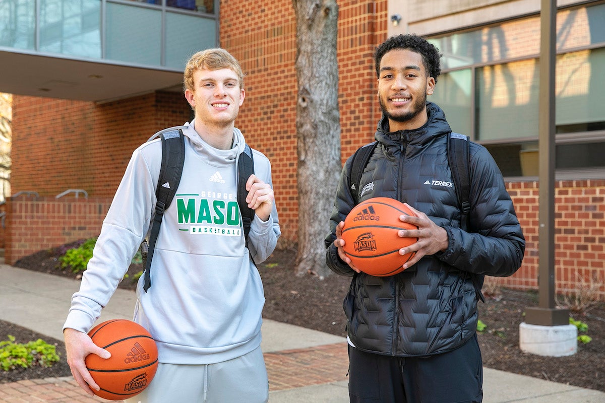 Mason men's basketball players, Blake Buchanan, left, and D'Shawn Schwartz
