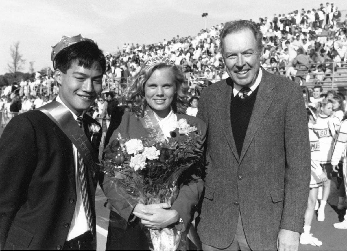 three people in black and white at soccer game
