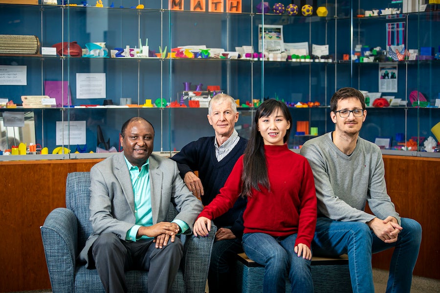 The interdisciplinary research team, from left to right, Grim Urgessa, Rainald Löhner, Lingquan Li, and Facundo Airaudo. Photo by Cristian Torres.