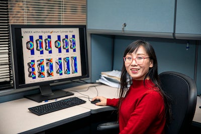 Lingquan Li presents her team's work on underwater explosions. Photo by Cristian Torres.