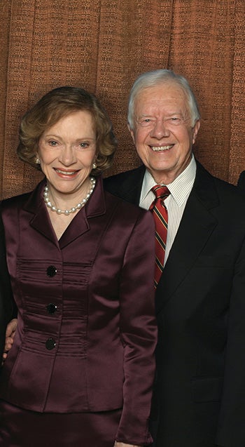 Jimmy and Rosalynn Carter pictured together smiling.