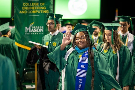 students processing at graduation