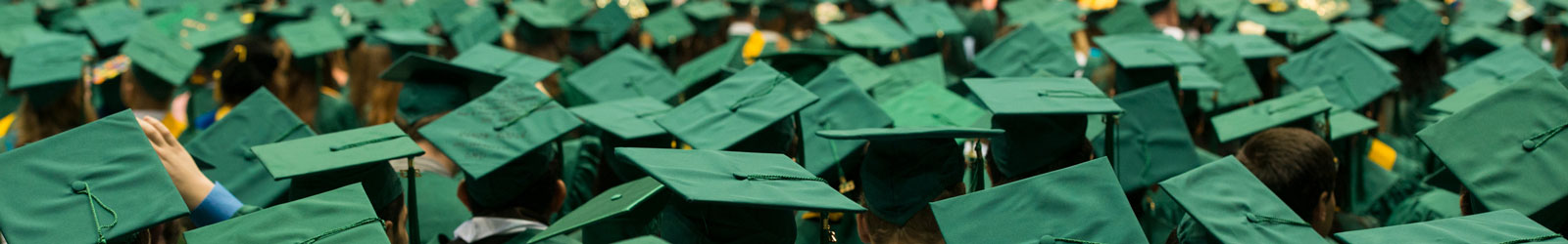 view of graduation caps of graduates in Mason's EagleBank Arena on Fairfax Campus