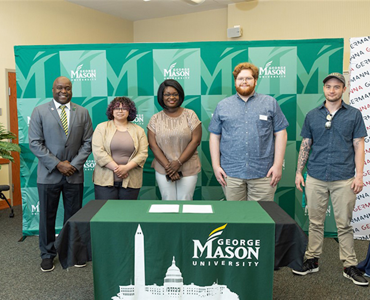 Mason President Gregory Washington with recent Germanna grads who will be attending Mason