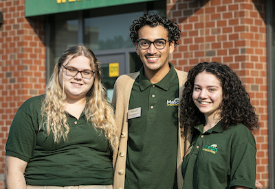 Mason Ambassadors pose in front of the Visitors Center