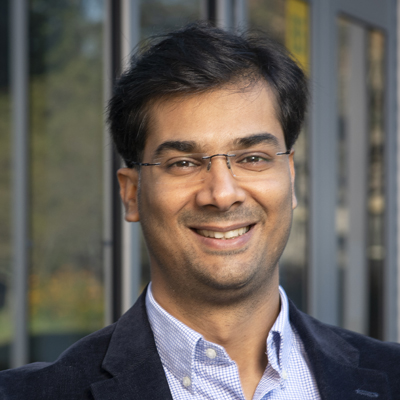 Hemant Purohit wears a dark suit, pale-blue shirt, and glasses in his faculty profile for the IST department at George Mason University.