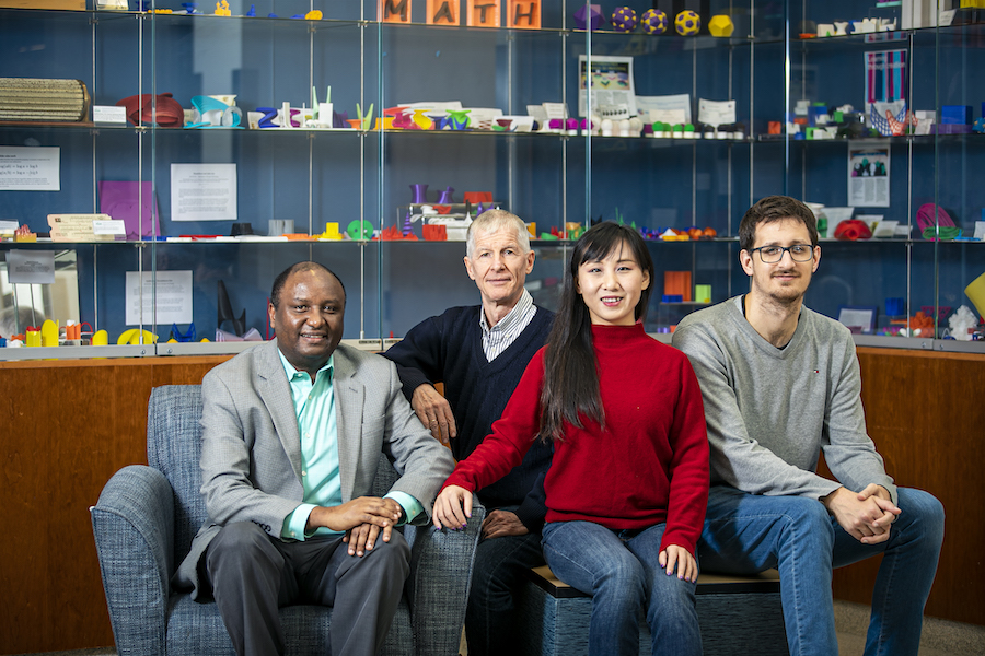 The interdisciplinary research team, from left to right, Grim Urgessa, Rainald Löhner, Lingquan Li, and Facundo Airaudo. Photo by Cristian Torres.