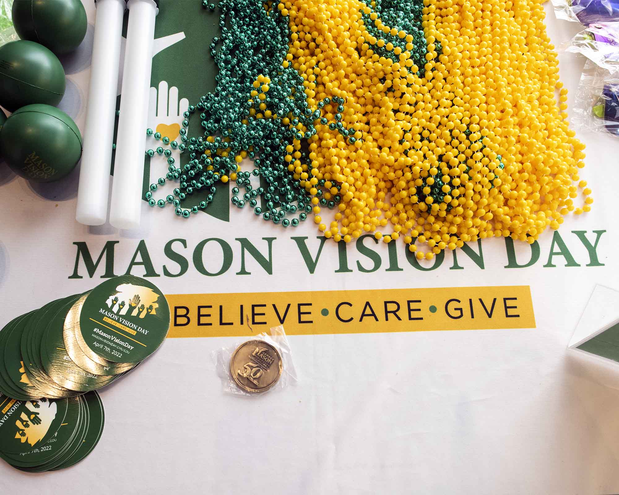vision day graphic with green and gold beads, stickers, and more