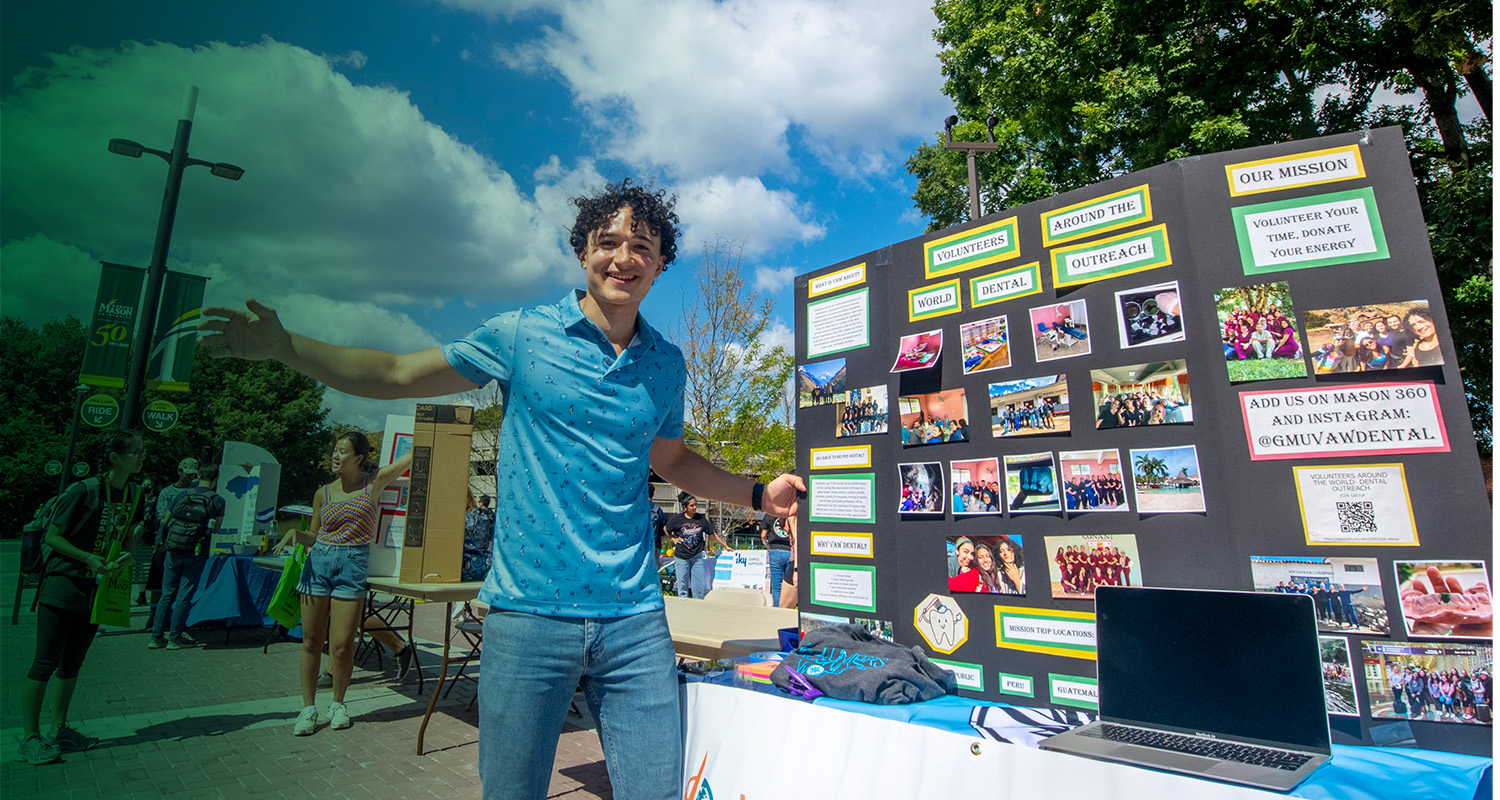 A Mason student shares information about their volunteer organization on the Fairfax Campus.