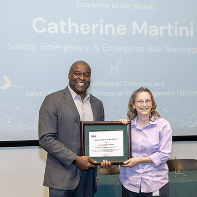 President Gregory Washington with Employee of the Month Catherine Martini