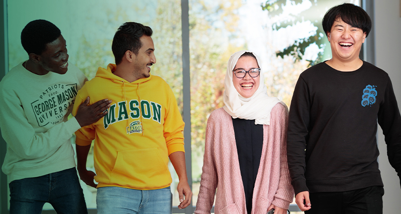 A group of INTO students smile together on the Mason campus