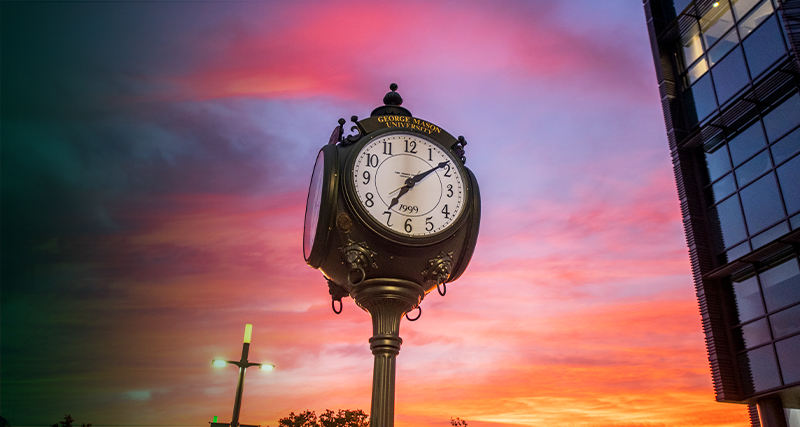 The Mason clock stands out against a beautiful sunset over Wilkins Plaza on the Fairfax Campus.