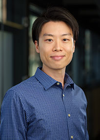 Daigo Shishika wears a dark-blue shirt in his faculty profile for the Department of Mechanical Engineering