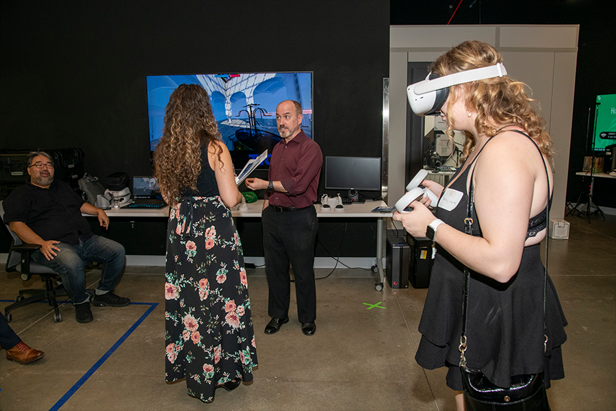 Guests test out the virtual reality demonstration with the Computer Game Design program at ARTS! By George 2022. (Photo by Cable Risdon Photography)