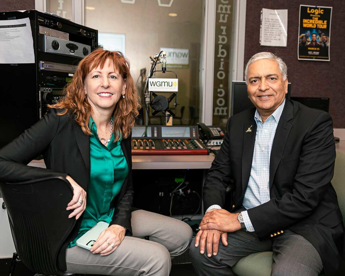 Paula Sorrel and Ajay Vinzé pose for a photo in the WGMU recording studio
