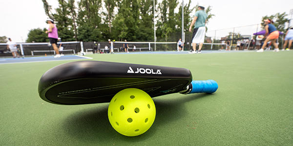 pickleball paddle and ball on Mason's new pickleball courts
