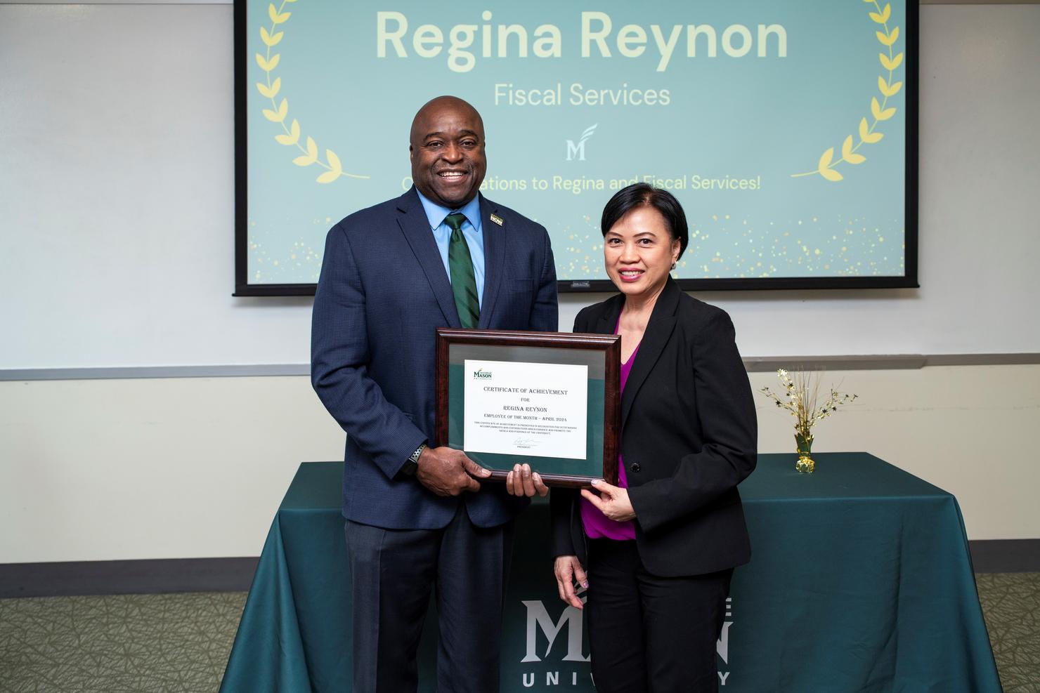 Mason President Gregory Washington and Employee of the Month Regina Reynon at the ceremony