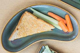Toast with celery and carrot sticks