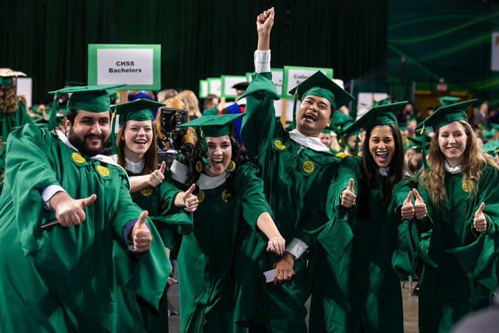 Members of the Winter 2019 graduating class celebrate in Mason's EagleBank Arena on the Fairfax Campus
