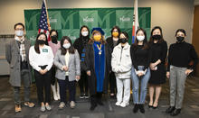Vice Provost Janette Muir poses with a group of Mason Korea students at their graduation celebration.