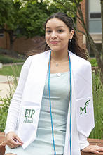Monica Amaya is shown outside wearing her EIP stole