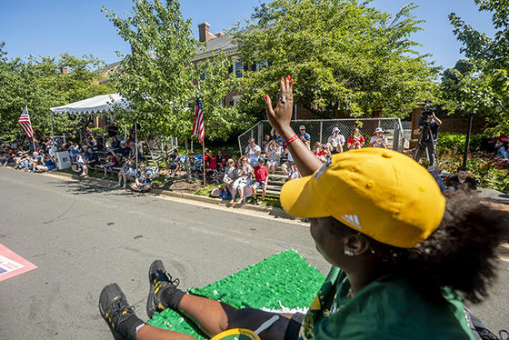 Crowds along the parade route greet the Mason Athletics Float