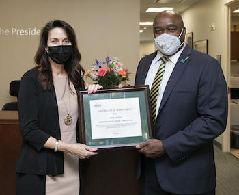 Employee of the Month Tina Jones with President Washington. Photo by Ron Aira/Creative Services