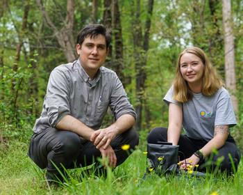 Professor Daniel Hanley and student Anna Siegle pose in the field research location for the study. 