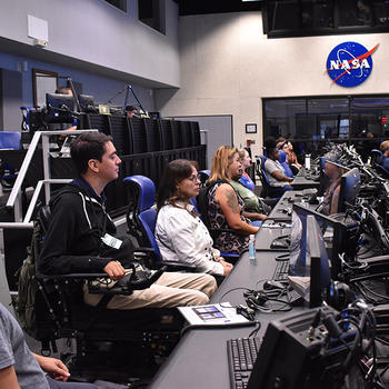 Ricky Chang sits in NASA control room